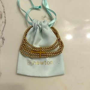 ENewton Bracelet.  Five classic gold bead bracelets connected by a cross.